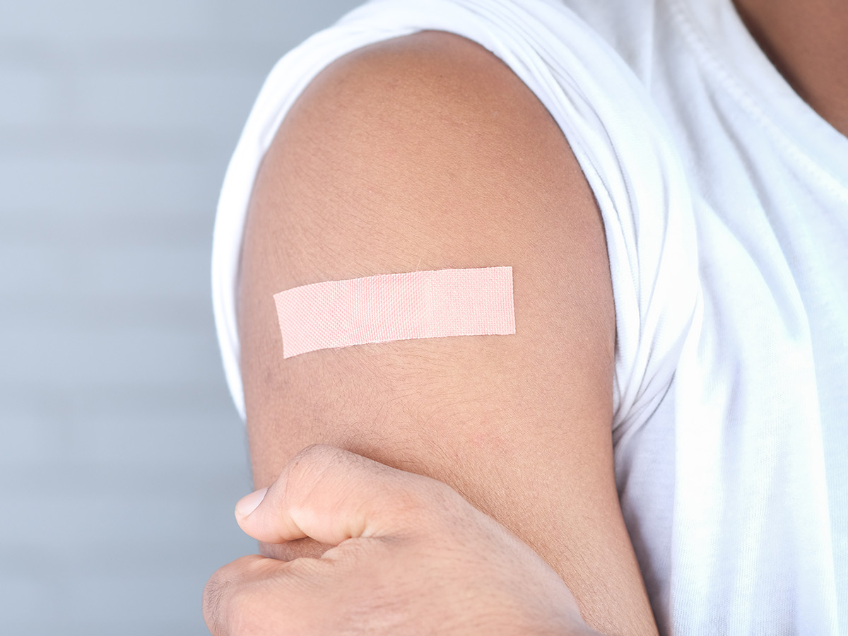 arm with a bandaid on it