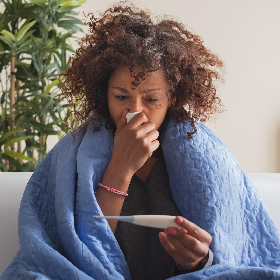 Woman sick at home with the flu