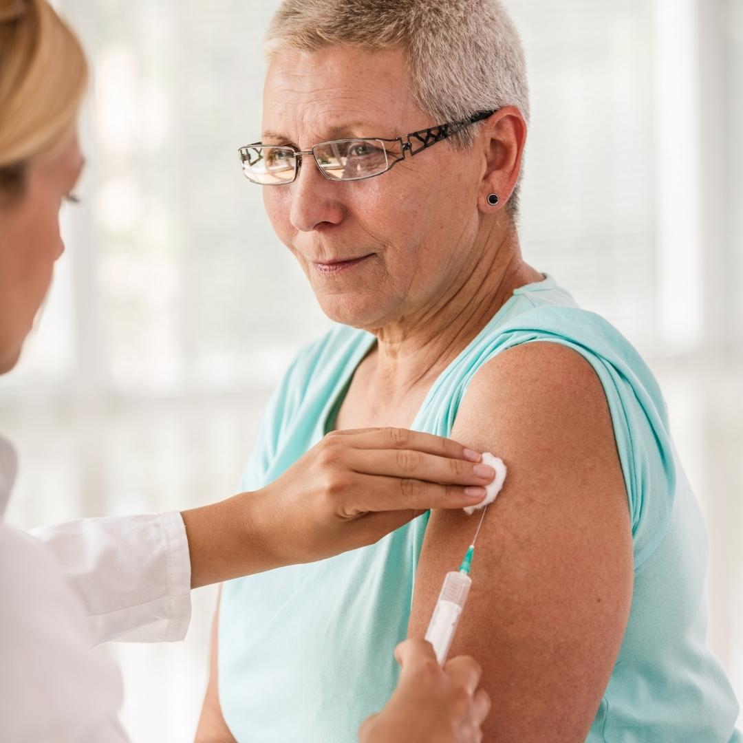 Older woman getting a flu vaccine