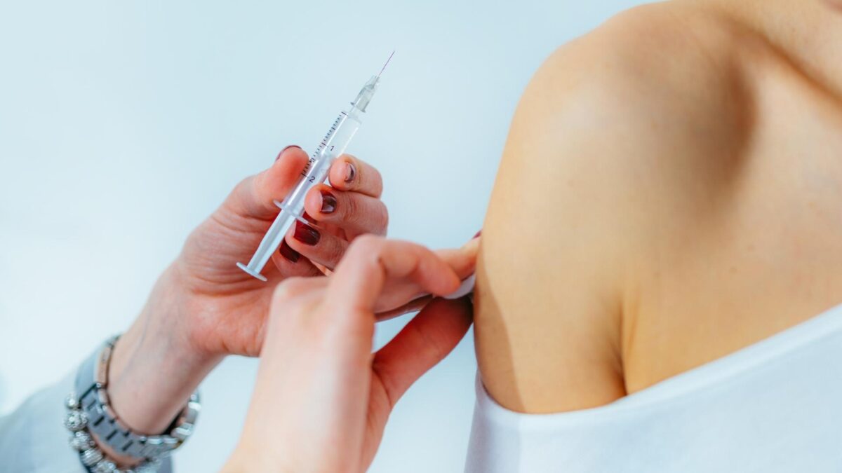 Woman receiving a flu vaccine