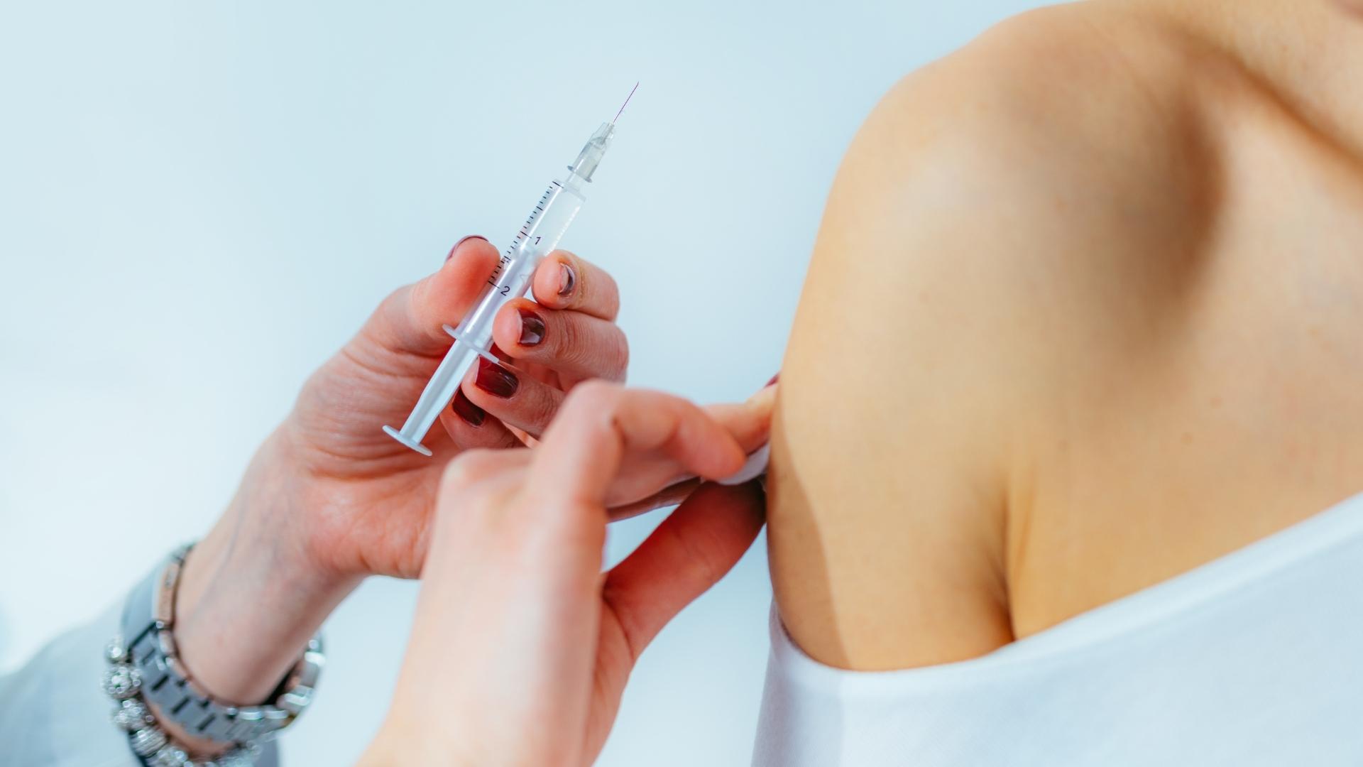 Woman receiving a flu vaccine