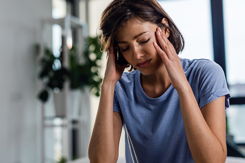 image of a woman with a headache