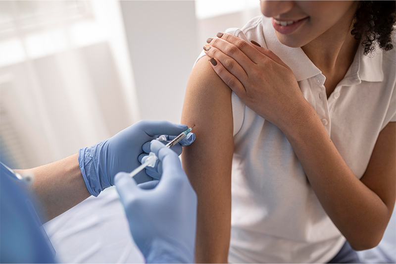 Image of a woman getting a vaccination