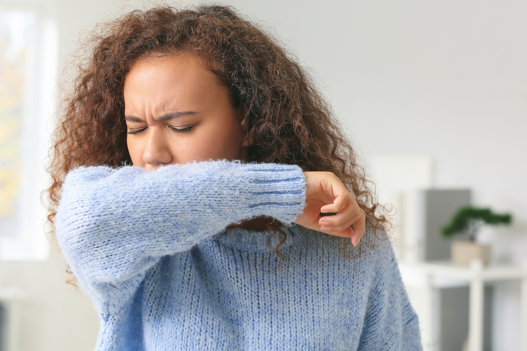 Woman coughing